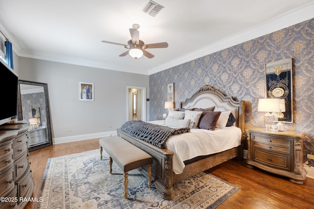 303 Duperier Ave, New Iberia, LA 70563 - bedroom with wallpapered walls, crown molding, wood finished floors, baseboards, and a ceiling fan