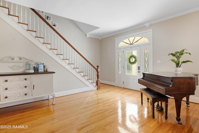303 Duperier Ave, New Iberia, LA 70563 - entryway featuring ornamental molding, light wood-style flooring, stairway, and baseboards