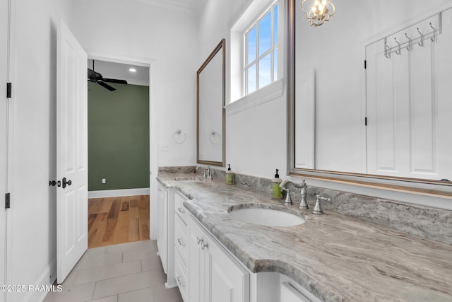 3132 Veranda View Ave, Baton Rouge, LA 70810 - full bathroom featuring double vanity, baseboards, tile patterned floors, a ceiling fan, and a chandelier