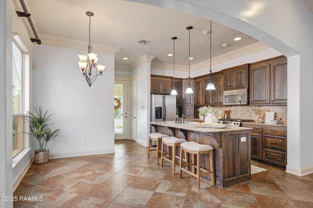 109 Flamingo Row, Lafayette, LA 70508 - kitchen with stainless steel appliances, decorative backsplash, crown molding, a kitchen island with sink, and a breakfast bar