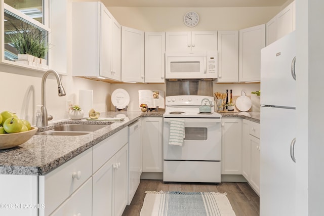 531 Silver St, New Iberia, LA 70560 - kitchen with white appliances, white cabinets, light wood-type flooring, and light stone counters