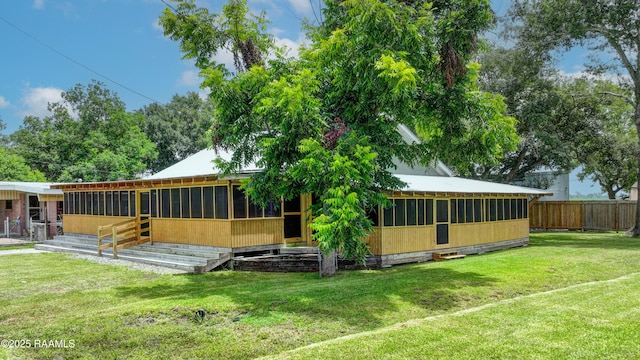 531 Silver St, New Iberia, LA 70560 - rear view of house with a sunroom
