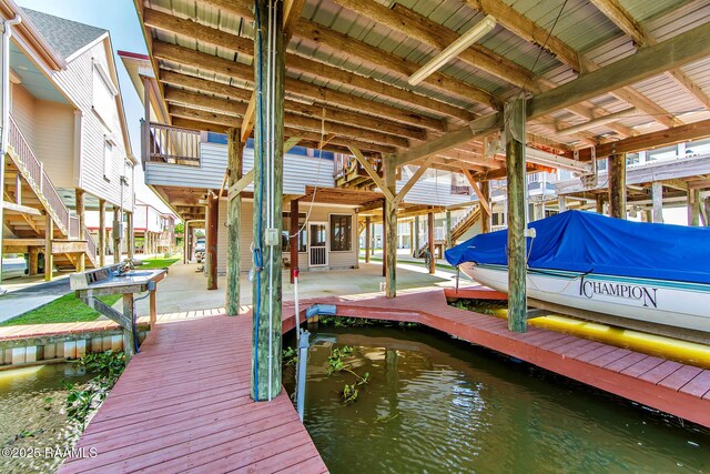 178 Flounder Ct, Dulac, LA 70353 - dock area featuring boat lift