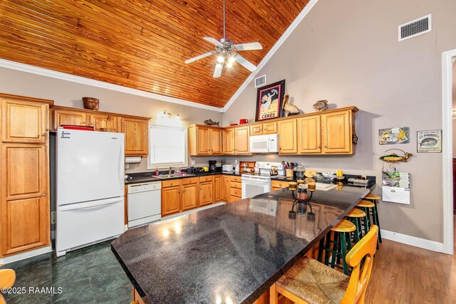 178 Flounder Ct, Dulac, LA 70353 - kitchen with white appliances, a sink, wood ceiling, dark countertops, and ornamental molding
