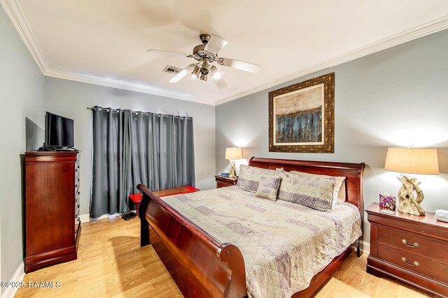 178 Flounder Ct, Dulac, LA 70353 - bedroom featuring light wood-style floors, ornamental molding, baseboards, and a ceiling fan