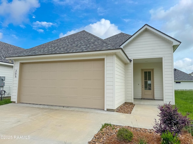 305 Berchman Oaks Dr, Lafayette, LA 70506 - view of front of house featuring a garage, a shingled roof, and concrete driveway