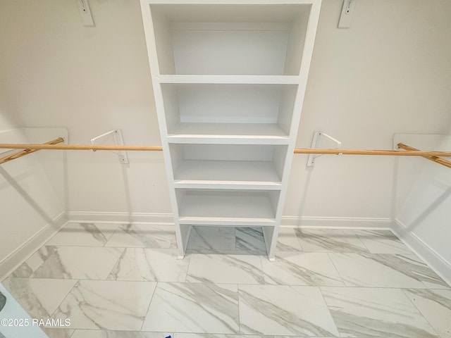 305 Berchman Oaks Dr, Lafayette, LA 70506 - walk in closet featuring marble look tiles