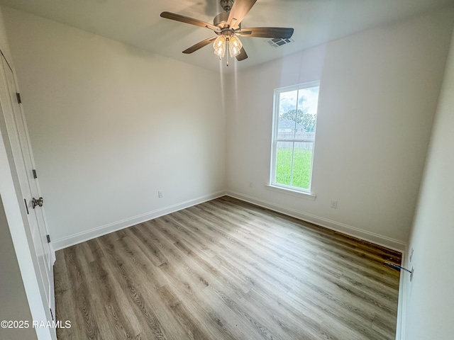 305 Berchman Oaks Dr, Lafayette, LA 70506 - empty room featuring wood finished floors, a ceiling fan, and baseboards