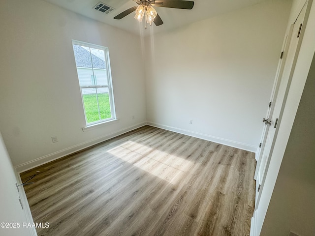 305 Berchman Oaks Dr, Lafayette, LA 70506 - empty room with ceiling fan, wood finished floors, and baseboards
