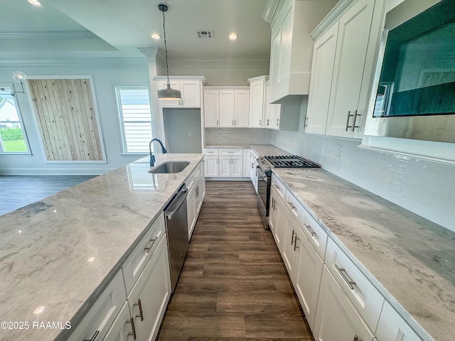 219 Timber Mill St, Lafayette, LA 70508 - kitchen featuring appliances with stainless steel finishes, crown molding, dark wood-style floors, a sink, and white cabinets