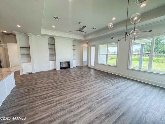 219 Timber Mill St, Lafayette, LA 70508 - unfurnished living room featuring ornamental molding, a raised ceiling, a ceiling fan, dark wood-style floors, and a fireplace