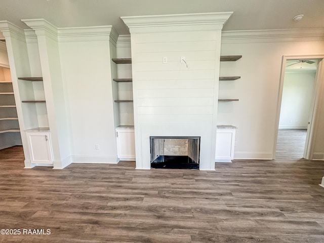 219 Timber Mill St, Lafayette, LA 70508 - unfurnished living room with baseboards, crown molding, wood finished floors, a fireplace, and built in features
