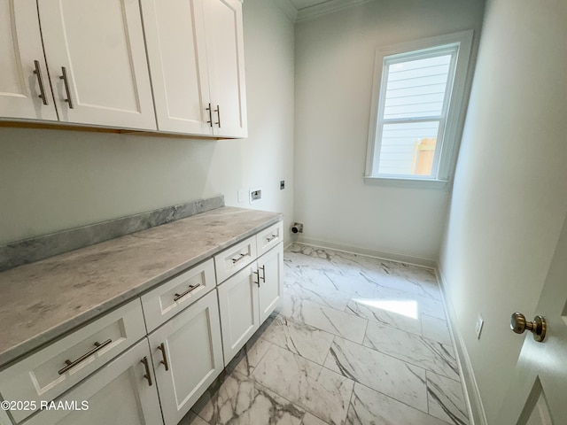 219 Timber Mill St, Lafayette, LA 70508 - laundry area featuring light marble finish flooring, cabinet space, electric dryer hookup, ornamental molding, and baseboards