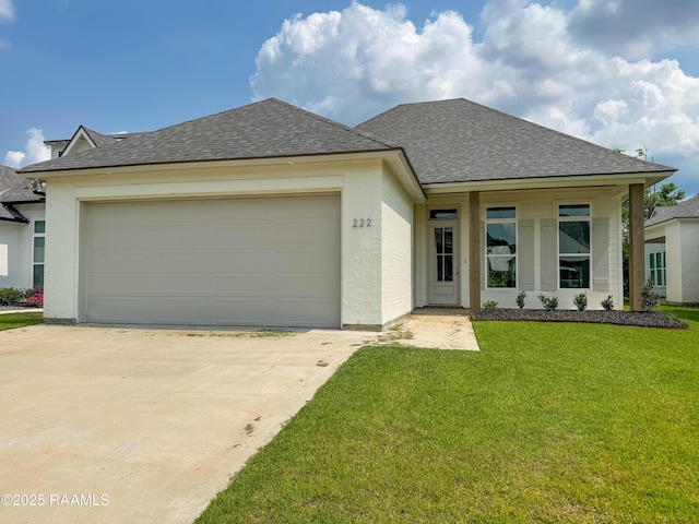 222 Timber Mill St, Lafayette, LA 70508 - view of front facade with roof with shingles, concrete driveway, a front yard, and an attached garage
