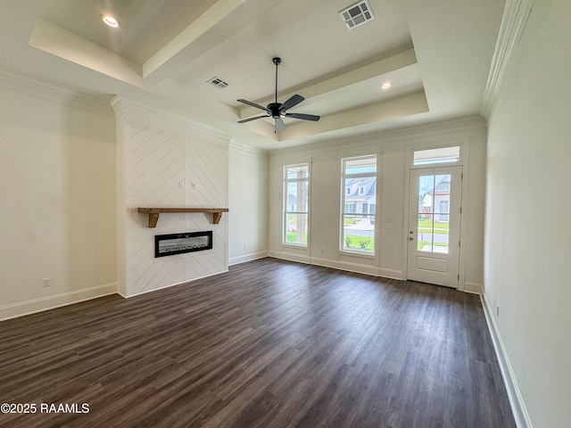 222 Timber Mill St, Lafayette, LA 70508 - unfurnished living room featuring healthy amount of natural light, dark wood-style floors, crown molding, a glass covered fireplace, and baseboards