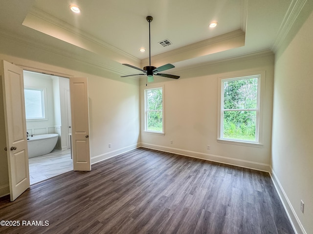 222 Timber Mill St, Lafayette, LA 70508 - spare room with crown molding, a raised ceiling, dark wood-type flooring, ceiling fan, and baseboards