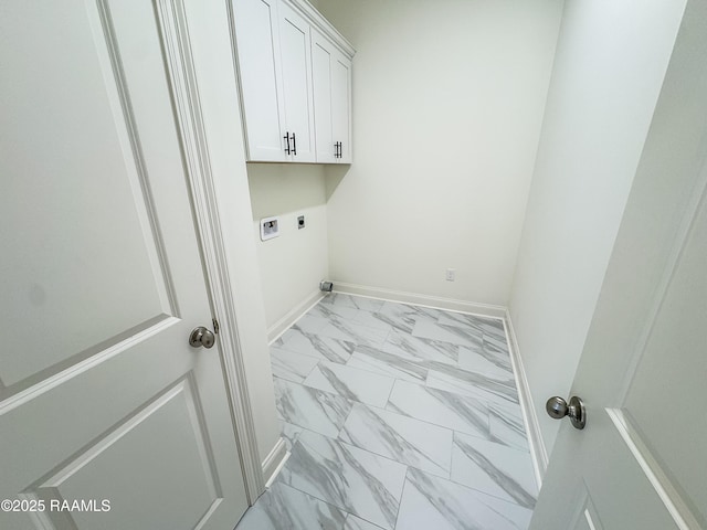 222 Timber Mill St, Lafayette, LA 70508 - laundry area with light marble finish floors, hookup for an electric dryer, cabinet space, and baseboards
