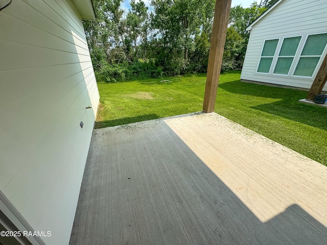 222 Timber Mill St, Lafayette, LA 70508 - wooden deck with a patio and a lawn