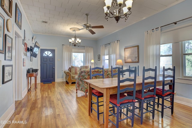 519 Mudd Ave, Lafayette, LA 70501 - dining area featuring a chandelier, crown molding, light wood-style floors, baseboards, and ceiling fan