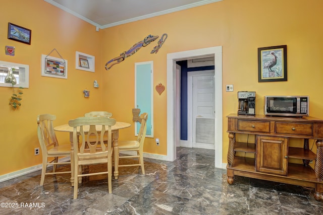 519 Mudd Ave, Lafayette, LA 70501 - dining space with marble tiled flooring, crown molding, and baseboards