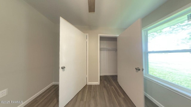 13734 Wilda Dr, Kaplan, LA 70548 - unfurnished bedroom with a closet, baseboards, and dark wood-style flooring