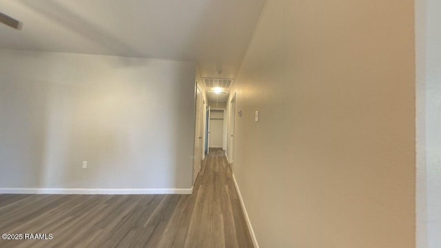 13734 Wilda Dr, Kaplan, LA 70548 - corridor featuring dark wood-style floors, baseboards, and attic access