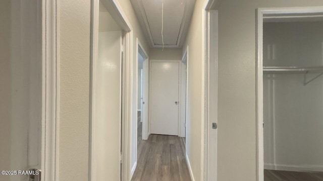 13734 Wilda Dr, Kaplan, LA 70548 - hallway featuring attic access, wood finished floors, and baseboards
