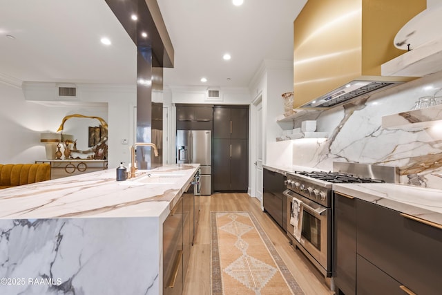 302 Richland Ave Unit 207C, Lafayette, LA 70508 - kitchen with appliances with stainless steel finishes, a sink, modern cabinets, ornamental molding, and light stone countertops