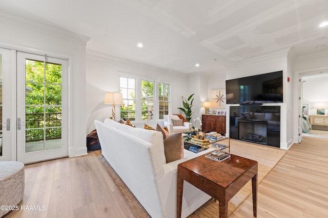302 Richland Ave Unit 207C, Lafayette, LA 70508 - living area featuring a glass covered fireplace, plenty of natural light, crown molding, recessed lighting, and light wood finished floors