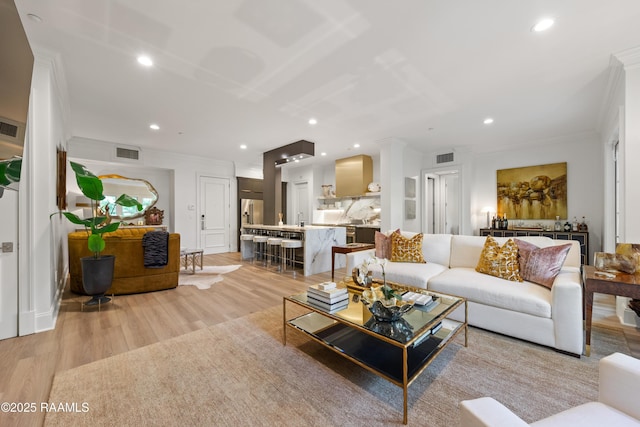 302 Richland Ave Unit 207C, Lafayette, LA 70508 - living room with light wood finished floors, crown molding, and recessed lighting