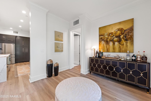302 Richland Ave Unit 207C, Lafayette, LA 70508 - living area featuring a dry bar, light wood-type flooring, baseboards, ornamental molding, and recessed lighting