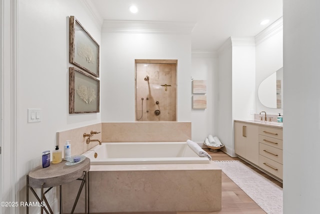 302 Richland Ave Unit 207C, Lafayette, LA 70508 - full bathroom with ornamental molding, a garden tub, vanity, tiled shower, and wood finished floors