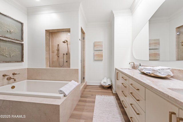 302 Richland Ave Unit 207C, Lafayette, LA 70508 - full bath featuring a shower stall, double vanity, a garden tub, ornamental molding, and wood finished floors