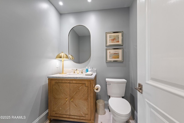 302 Richland Ave Unit 207C, Lafayette, LA 70508 - half bath featuring baseboards, vanity, toilet, and recessed lighting