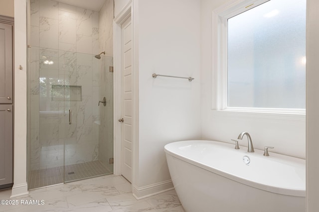 308 Manor House Ln, Lafayette, LA 70507 - bathroom featuring marble finish flooring, baseboards, a freestanding bath, and a marble finish shower