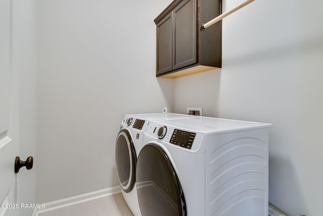 118 Barnet Ct, Lafayette, LA 70507 - laundry area with cabinet space, separate washer and dryer, baseboards, and light tile patterned floors