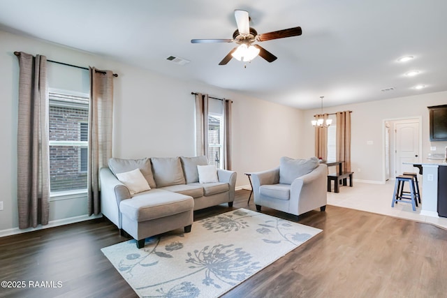 118 Barnet Ct, Lafayette, LA 70507 - living room featuring a chandelier, healthy amount of natural light, a ceiling fan, and wood finished floors