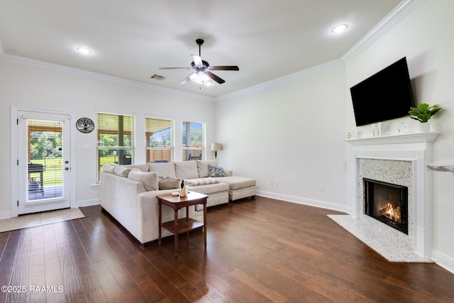 311 Victoria Lights Ln, Broussard, LA 70518 - living area with a ceiling fan, dark wood-type flooring, a premium fireplace, crown molding, and baseboards