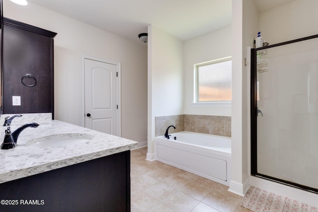 311 Victoria Lights Ln, Broussard, LA 70518 - bathroom with baseboards, a garden tub, a shower stall, double vanity, and tile patterned flooring