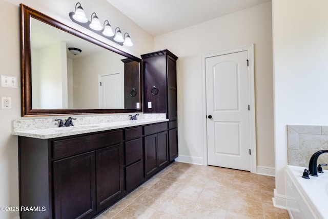311 Victoria Lights Ln, Broussard, LA 70518 - bathroom with double vanity, a garden tub, baseboards, and tile patterned floors