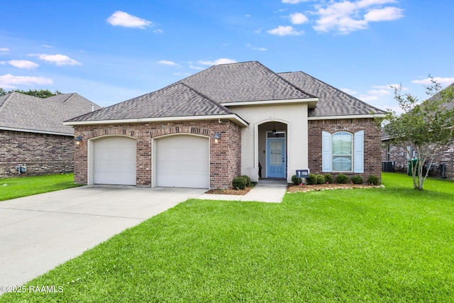 311 Victoria Lights Ln, Broussard, LA 70518 - french country inspired facade with a shingled roof, a garage, driveway, a front yard, and brick siding