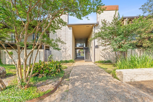 1008 S College Rd Unit 205, Lafayette, LA 70503 - property entrance featuring brick siding