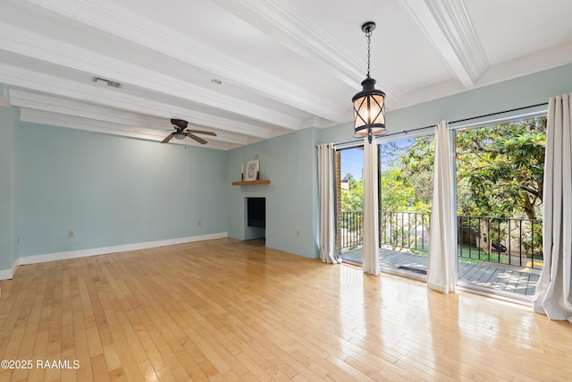 1008 S College Rd Unit 205, Lafayette, LA 70503 - unfurnished living room with beam ceiling, a fireplace, ceiling fan, light wood finished floors, and baseboards
