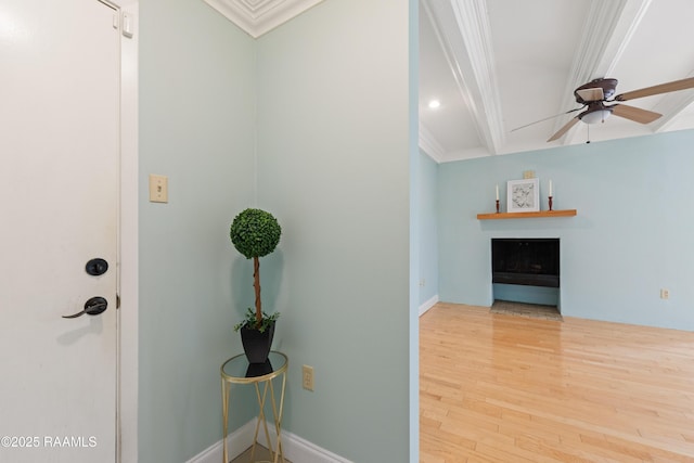 1008 S College Rd Unit 205, Lafayette, LA 70503 - entrance foyer featuring ornamental molding, a fireplace, wood finished floors, a ceiling fan, and beamed ceiling