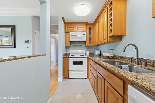 1008 S College Rd Unit 205, Lafayette, LA 70503 - kitchen with white appliances, a sink, dark stone countertops, brown cabinets, and open shelves