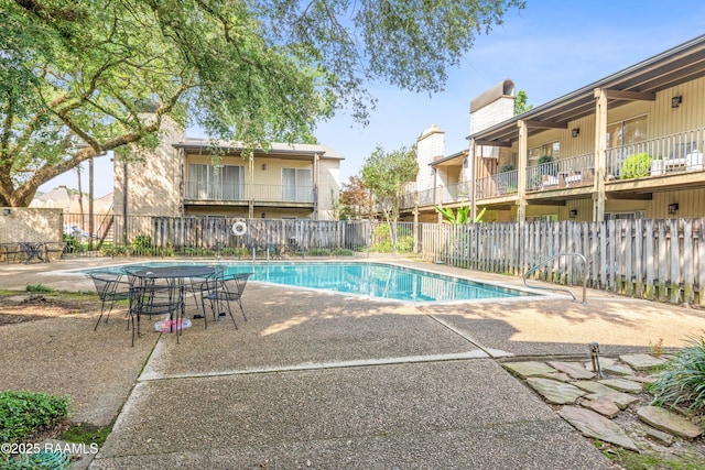 1008 S College Rd Unit 205, Lafayette, LA 70503 - community pool with a patio