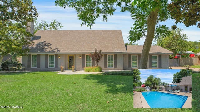 113 Templeton Dr, Lafayette, LA 70508 - view of front facade featuring a chimney, brick siding, and roof with shingles