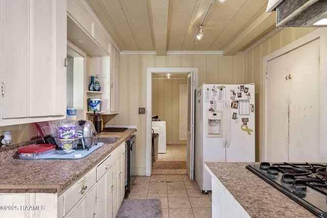 408 Section Ave, Rayne, LA 70578 - kitchen featuring black gas cooktop, light tile patterned floors, white fridge with ice dispenser, white cabinetry, and ornamental molding