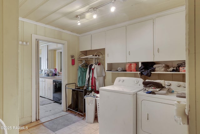 408 Section Ave, Rayne, LA 70578 - washroom with independent washer and dryer, ornamental molding, light tile patterned flooring, and cabinet space