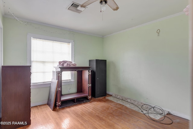 408 Section Ave, Rayne, LA 70578 - miscellaneous room featuring crown molding, ceiling fan, and wood finished floors